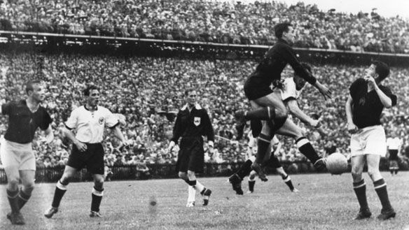 West German and Hungarian players vie for the ball during the 1954