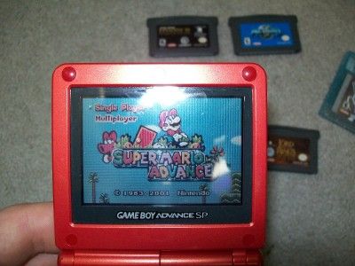 Red Nintendo Game Boy Advance SP with 7 Games 8 Game Cases and Charger